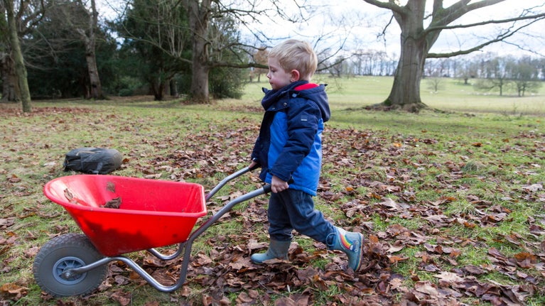 Boy with the Percy the Park Keeper wheel barrow activity at Kedleston Hall, Derbyshire